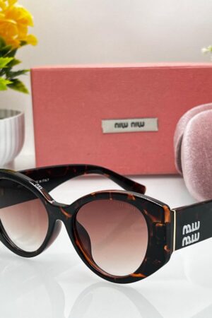 MIU MIU Sunglasses Black Unisex Model